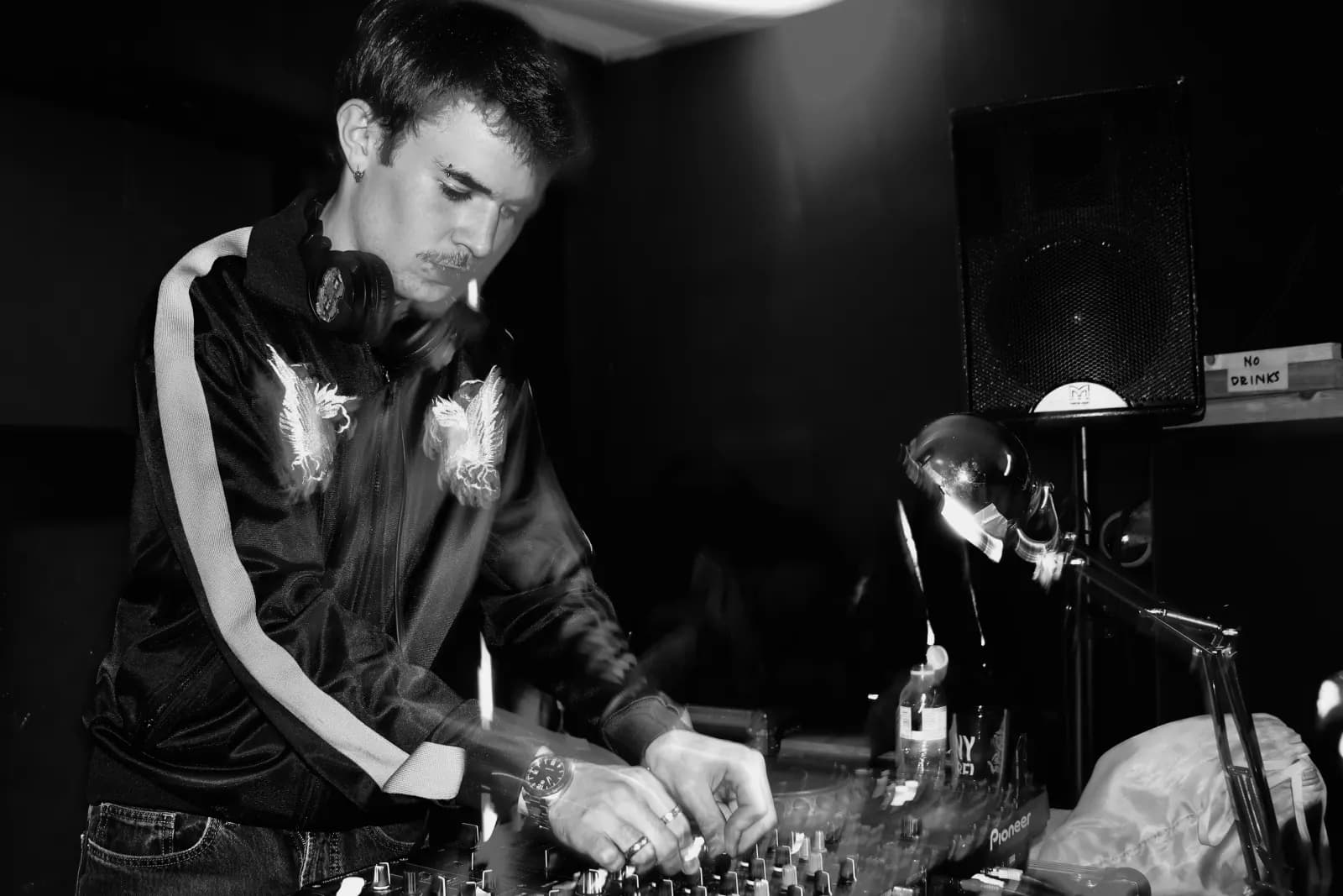 Black-and-white club room DJ portrait