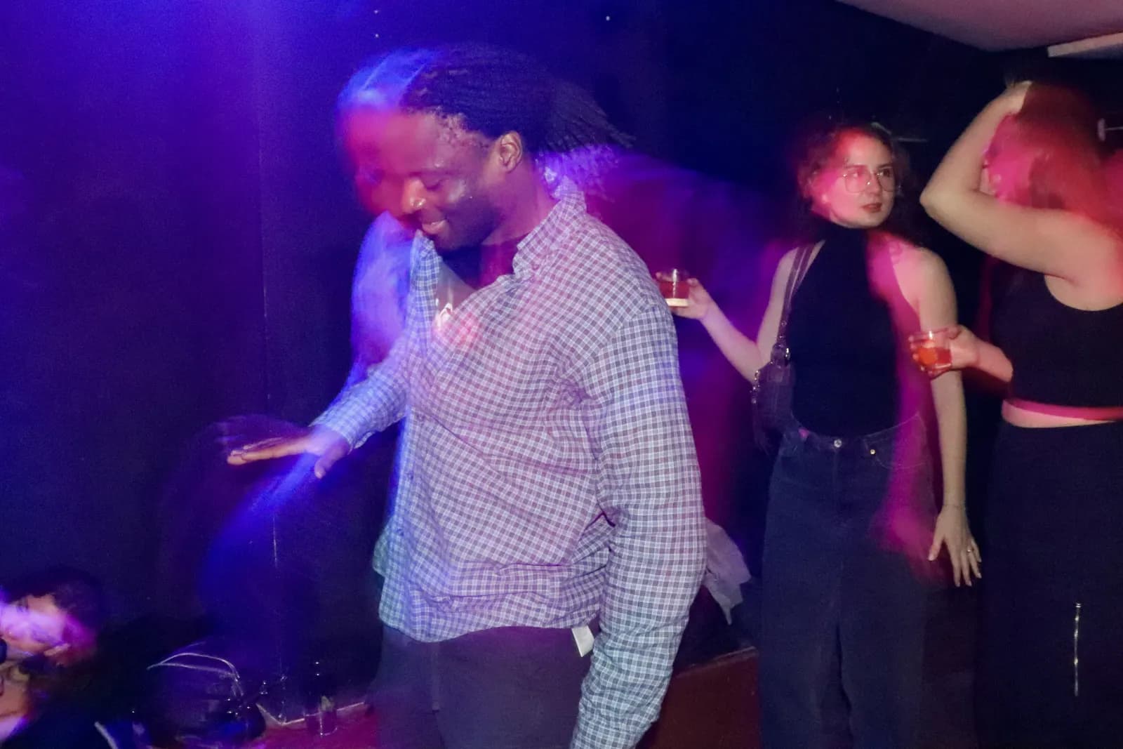 Dancing under blue and magenta light
